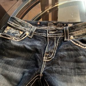 Miss Me straight leg blue with rhinestones in detail on pocket flap.